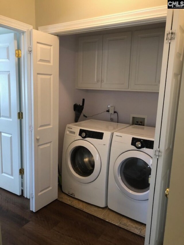 346 Arbor Oaks Ln, Irmo, SC 29063 - laundry area with separate washer and dryer, dark wood-style flooring, and cabinet space