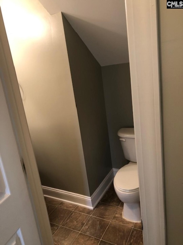 bathroom with tile patterned floors and toilet