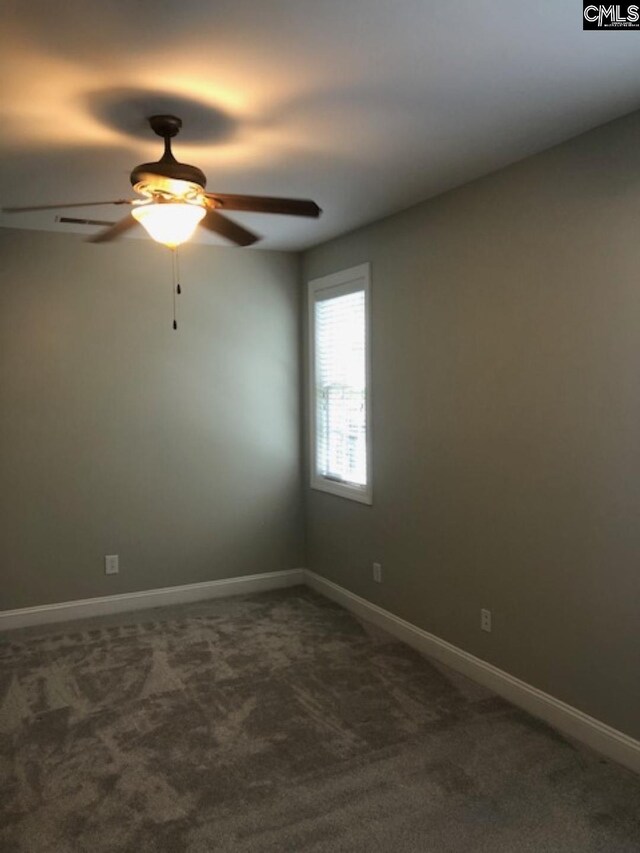 346 Arbor Oaks Ln, Irmo, SC 29063 - unfurnished room with dark carpet, a ceiling fan, and baseboards