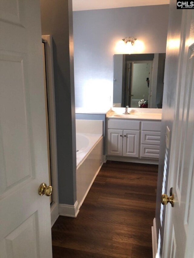 346 Arbor Oaks Ln, Irmo, SC 29063 - laundry area with separate washer and dryer, cabinet space, and dark wood finished floors