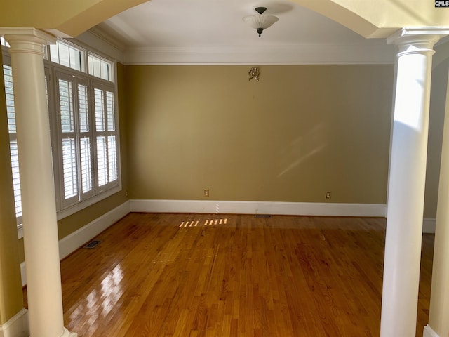 105 Overbranch Dr, Columbia, SC 29223 - spare room featuring ornate columns, plenty of natural light, arched walkways, and crown molding