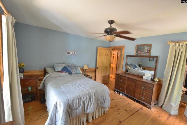 bedroom featuring light wood-type flooring and ceiling fan