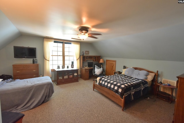 carpeted bedroom with ceiling fan and lofted ceiling