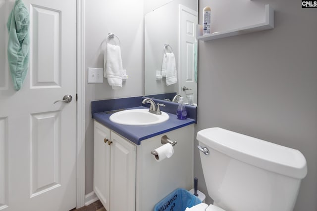 bathroom with vanity and toilet