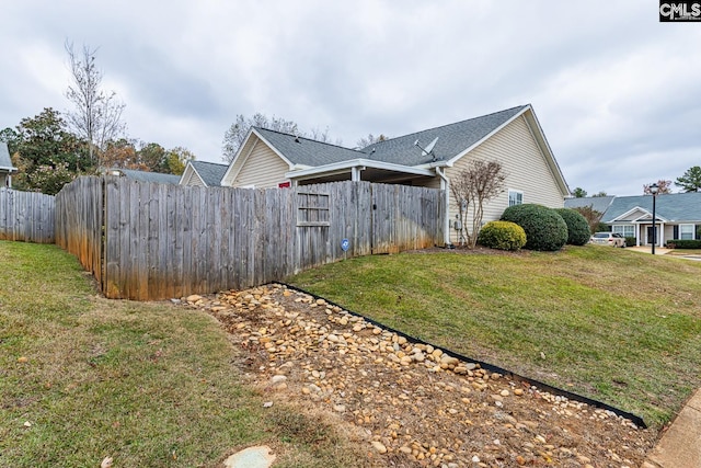 view of home's exterior with a yard