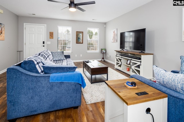 living room with dark hardwood / wood-style floors and ceiling fan