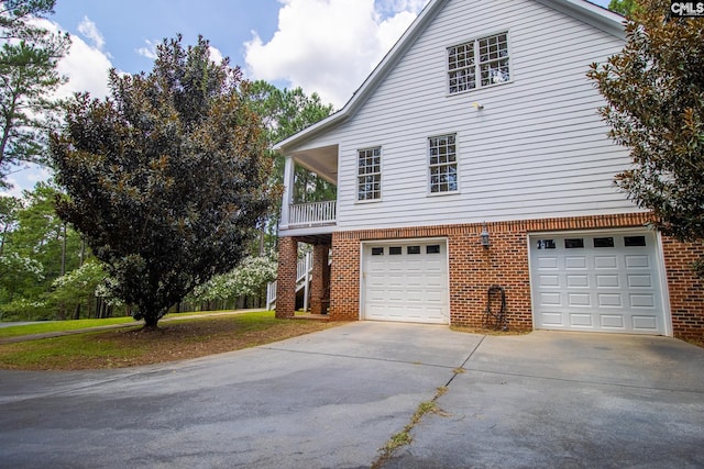 view of side of home featuring a garage