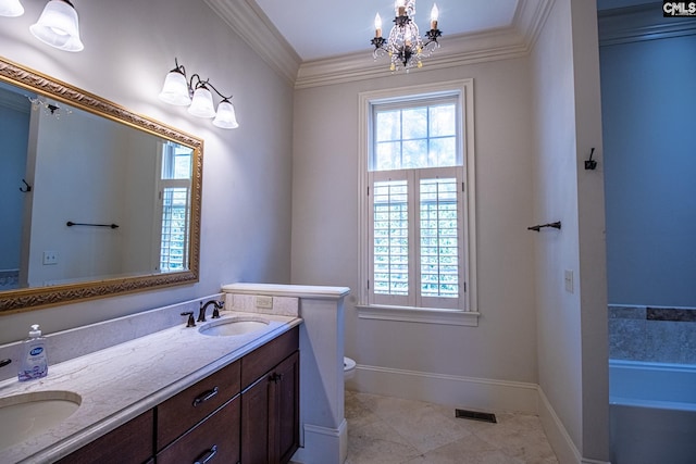 bathroom featuring vanity, a tub to relax in, an inviting chandelier, and crown molding