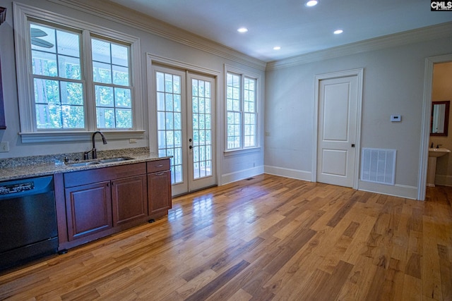 kitchen featuring french doors, crown molding, sink, dishwasher, and light hardwood / wood-style floors