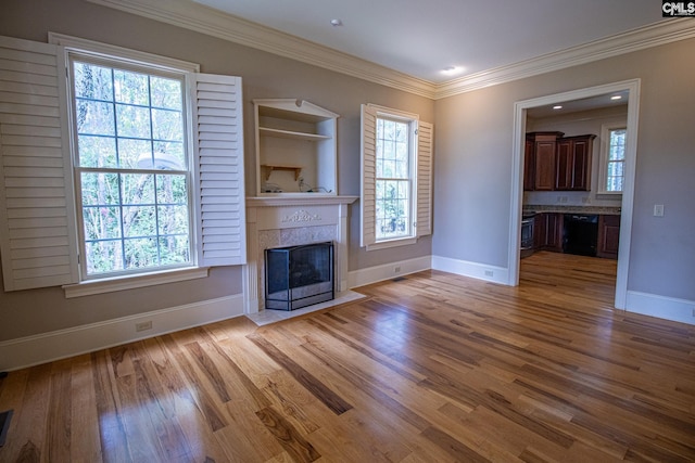 unfurnished living room featuring light hardwood / wood-style floors and ornamental molding