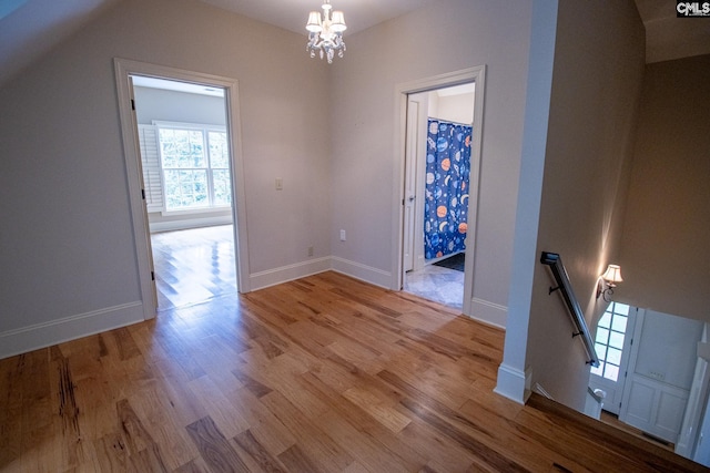 interior space with a chandelier and light hardwood / wood-style flooring