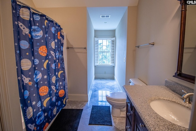 bathroom with vanity and toilet