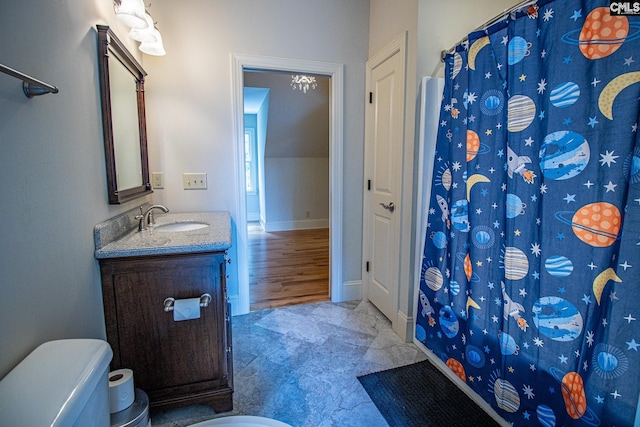 bathroom with vanity, hardwood / wood-style flooring, and walk in shower