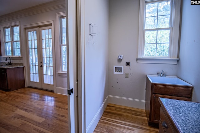 bathroom featuring french doors, vanity, and hardwood / wood-style flooring