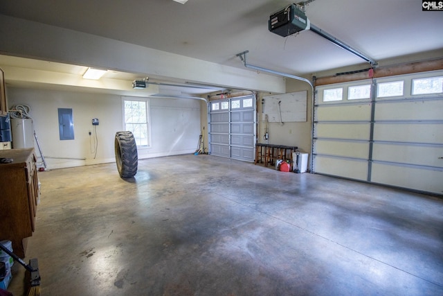 garage with electric panel and a garage door opener