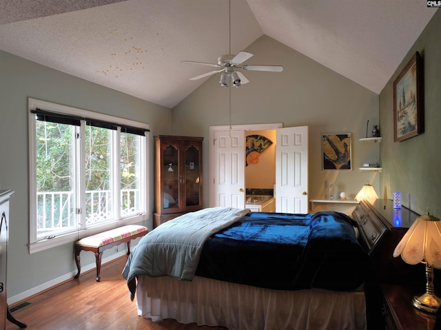 bedroom featuring ceiling fan, light hardwood / wood-style floors, and lofted ceiling