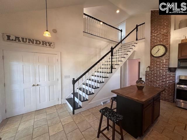 foyer with high vaulted ceiling