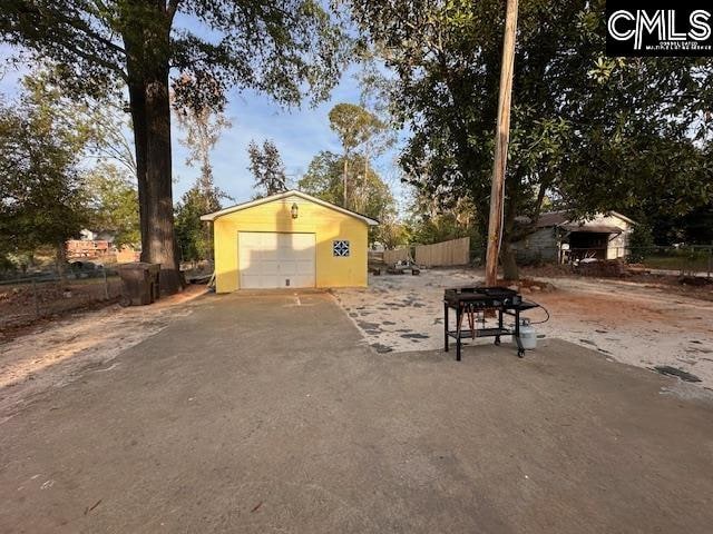 exterior space with an outbuilding and a garage