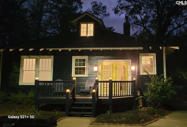 view of front of property with a wooden deck