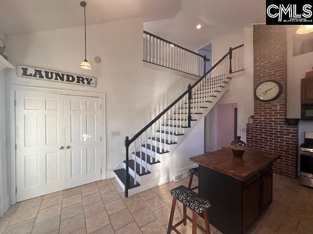 foyer entrance with a towering ceiling