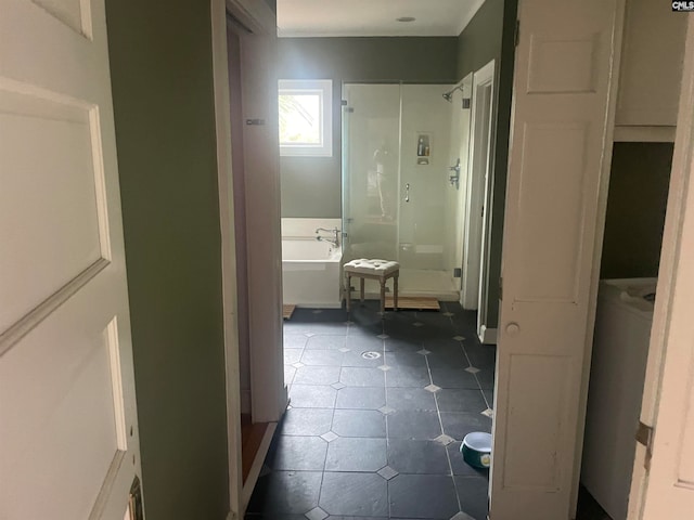 bathroom featuring independent shower and bath