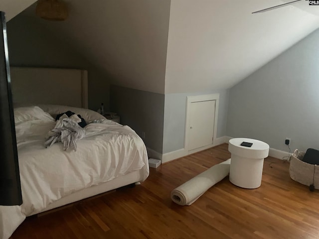 bedroom with wood-type flooring and ceiling fan