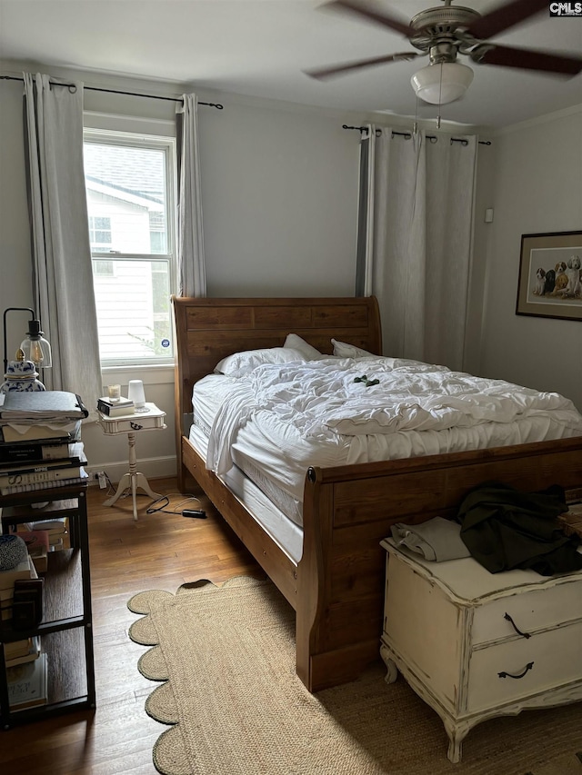 bedroom featuring light hardwood / wood-style floors and ceiling fan