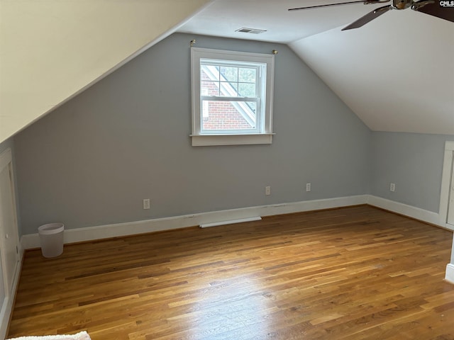 bonus room featuring wood-type flooring, ceiling fan, and lofted ceiling