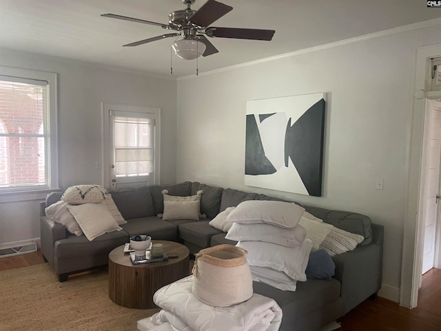 living room featuring ceiling fan, crown molding, and hardwood / wood-style flooring