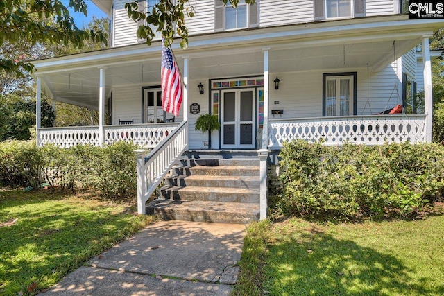 property entrance with a yard