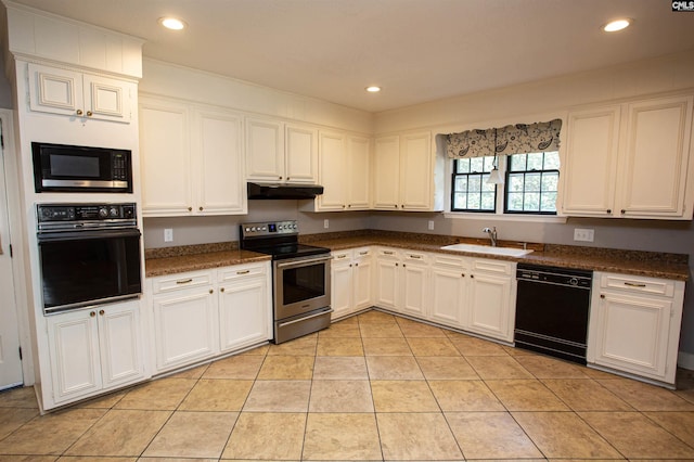 kitchen featuring white cabinets, light tile patterned floors, sink, and black appliances