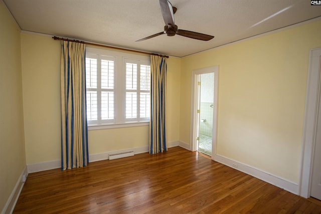 empty room with ceiling fan, wood-type flooring, and a textured ceiling