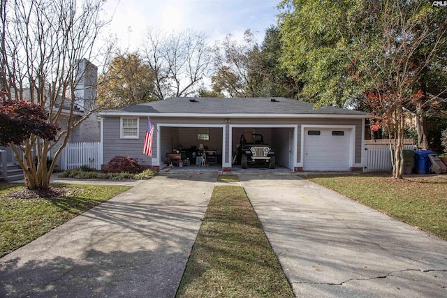 view of front of home featuring a front yard and a garage