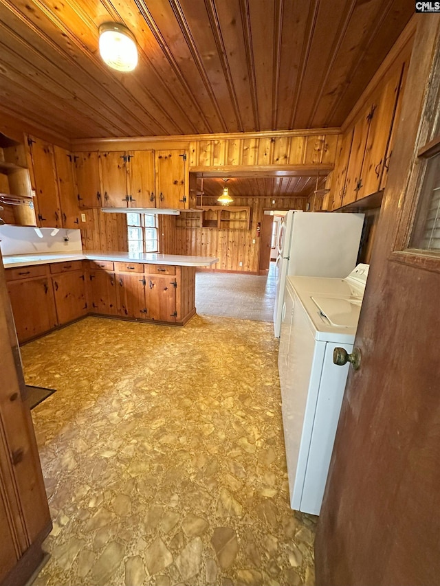 kitchen featuring separate washer and dryer, wooden walls, kitchen peninsula, and wooden ceiling