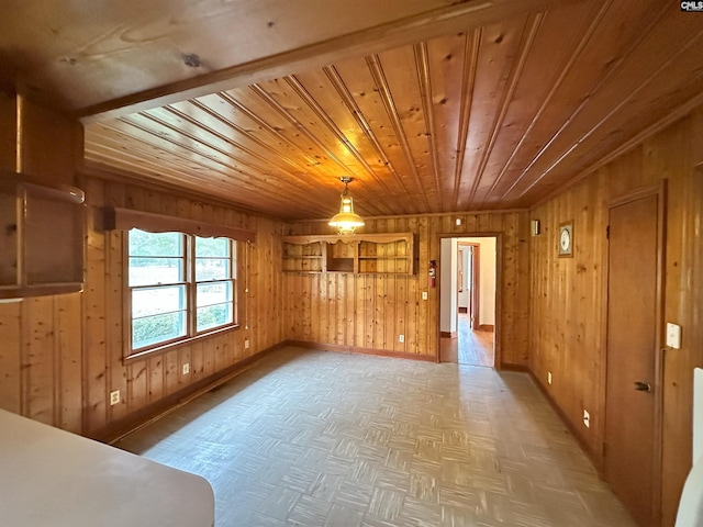 unfurnished room with wooden walls, parquet floors, and wooden ceiling