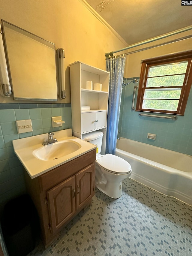 full bathroom featuring crown molding, toilet, shower / tub combo with curtain, vanity, and tile walls