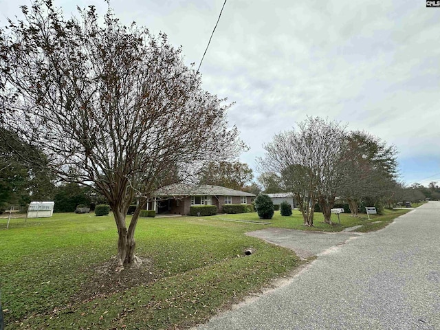 exterior space with a front lawn