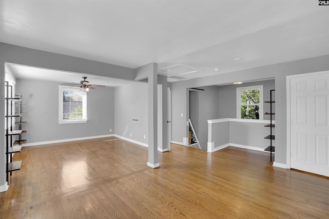 interior space with light hardwood / wood-style flooring, a wealth of natural light, and ceiling fan