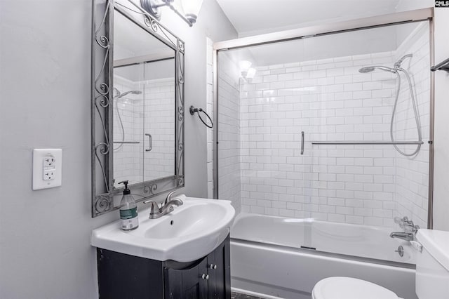 full bathroom with vanity, toilet, and shower / bath combination with glass door