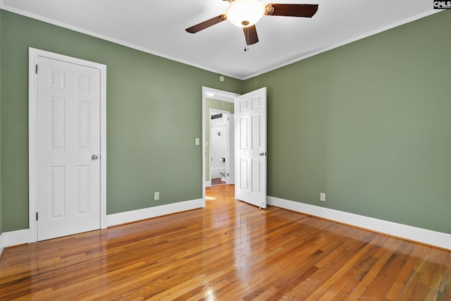 unfurnished bedroom featuring ceiling fan, light hardwood / wood-style flooring, and ornamental molding