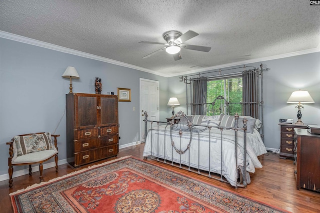 bedroom with ceiling fan, hardwood / wood-style floors, a textured ceiling, and ornamental molding