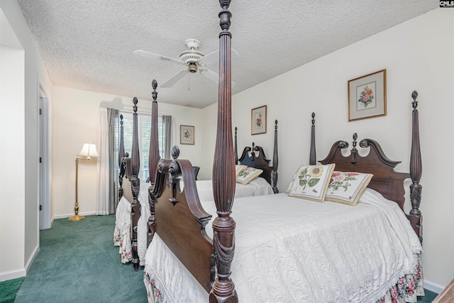 carpeted bedroom featuring ceiling fan and a textured ceiling