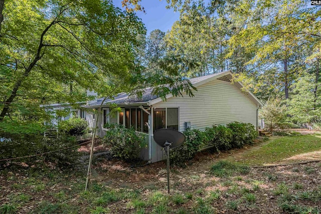 view of home's exterior featuring a sunroom