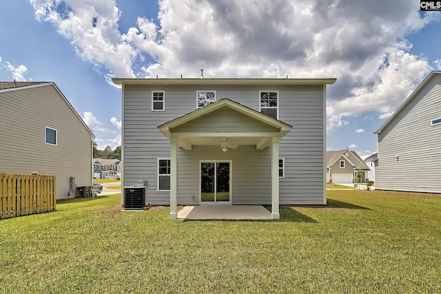 rear view of house with central AC unit, a yard, a patio area, and ceiling fan