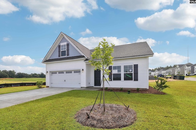 view of front facade featuring a garage and a front yard