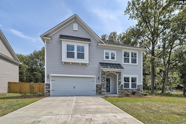 view of front facade with a front yard and a garage