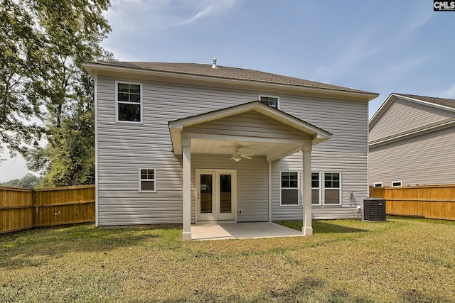 rear view of property with a yard, a patio, and ceiling fan