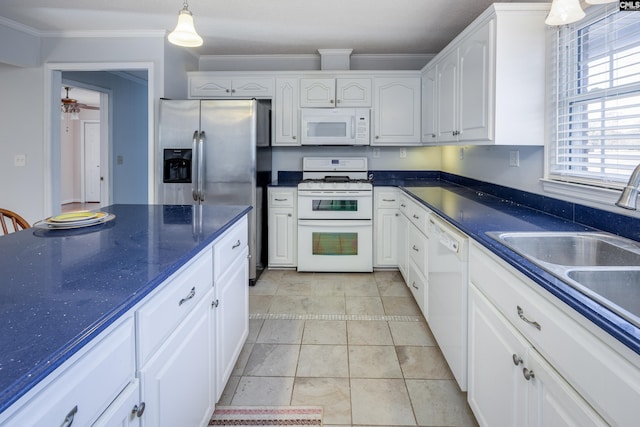 kitchen with white cabinets, white appliances, hanging light fixtures, and crown molding