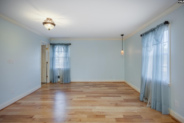 unfurnished room featuring crown molding and light hardwood / wood-style flooring