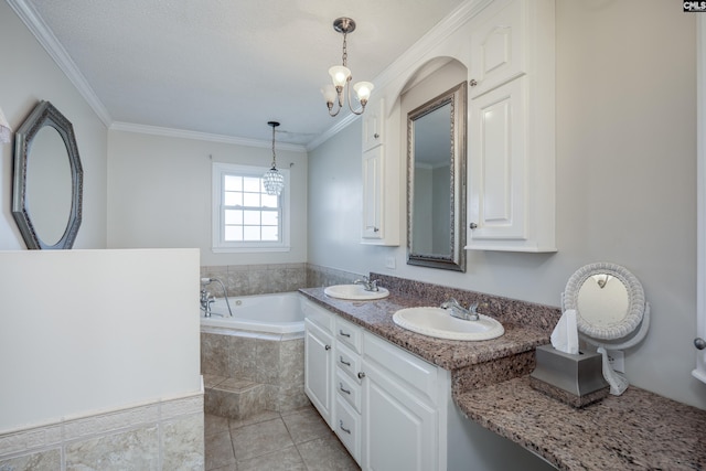 bathroom with tile patterned flooring, a notable chandelier, tiled tub, vanity, and ornamental molding